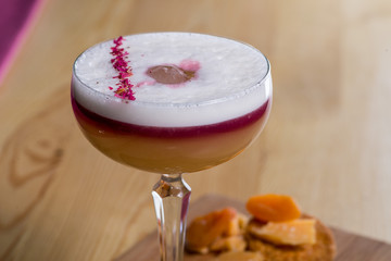 drink in a beautiful glass on the bar