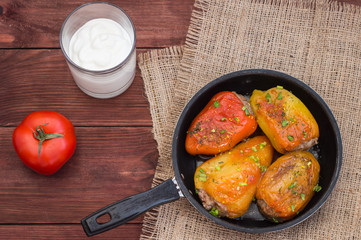 Stuffed pepper. Wooden background. Top view