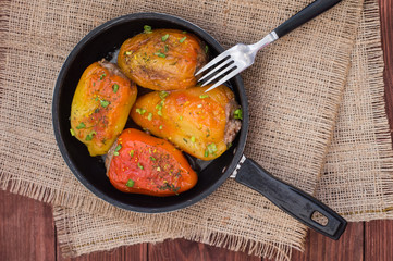 Stuffed pepper. Wooden background. Top view