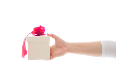 Gift box and red ribbon on hand with white background