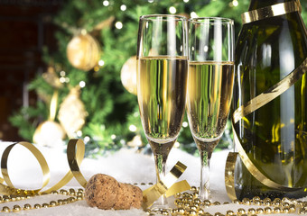 New Year champagne , Christmas tree background, snow