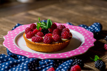tart with cream and raspberries