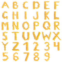 Alphabet made of macaroni letters isolated on white background - 130836700