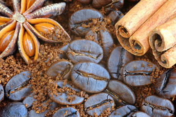 Coffee closeup. Ground coffee, coffee beans, cinnamon and star anise.