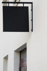 Black signboard on wall. Square shape mock up.