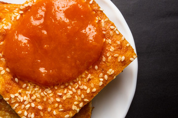 cheesecake with sesame seeds and jam