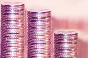 Coins stacked in bars . The concept of market instability