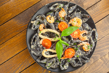 delicious fresh  pasta Neri on plate with shrimp