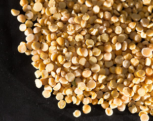 yellow peas on a black background