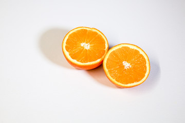 Oranges on a white surface