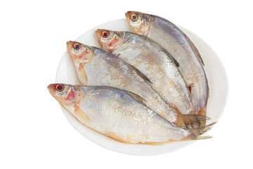 peled raw fish on a white plate on  white background