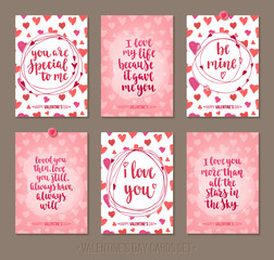 Set Valentine's Day greeting cards with handwritten brush calligraphy and decorative elements.