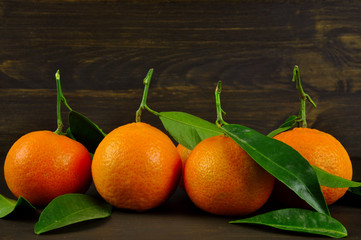 Mandarins. Tangerines. On wooden background