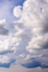 Bright dark blue sky with dramatic clouds. Aerial sky and clouds background. Image of white fluffy clouds in the blue sky for background usage