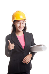 Asian engineer woman with blueprints show thumbs up.