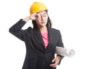 Tried Asian engineer woman with blueprints.