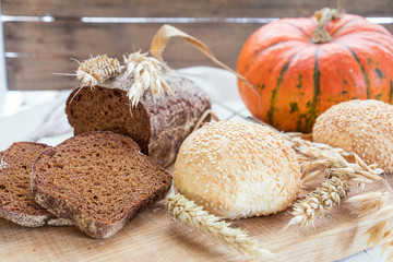 Freshly baked breads with ears and pumpkin. Shallow depth of field. Coloring and processing photo.