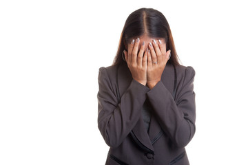 Sad young Asian businesswoman cry with palm to face.
