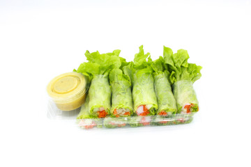 Salad roll with sauce in package, isolated picture