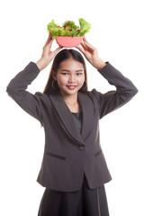Healthy Asian business woman with salad.