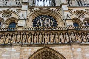 Fototapeta na wymiar Notre Dame Wall Carvings and Window