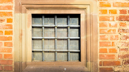 square window with iron grating