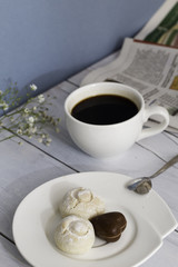 Cup of coffee, cookies and newspaper