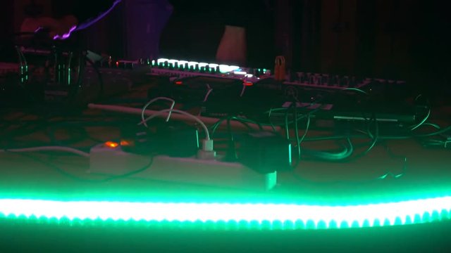 Live performance of an electronic DJ on the mixing console