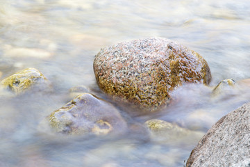 background of turbulent water in the mountain river