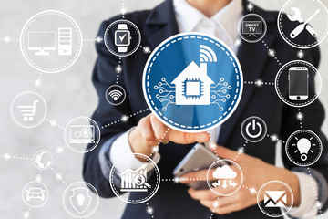 Businessman presses smart home icon with microchip. Businesswoman touched house sign with chip symbol and wifi. 