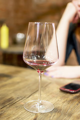 woman drinking alcohol. Focus on wine glass