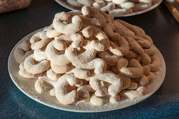 Traditional Czech Christmas vanilla rolls cookies sweets bake homemade full table plate detail background