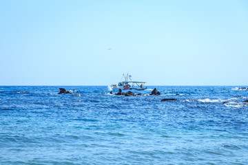 A lone fishing boat in the sea Greece