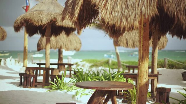 Tiki bar tables at a beach resort