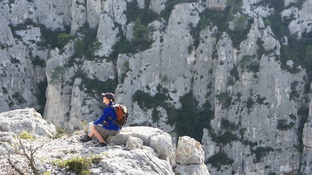 Young female tourist enjoying beautiful view in the mountains, Calanques, France