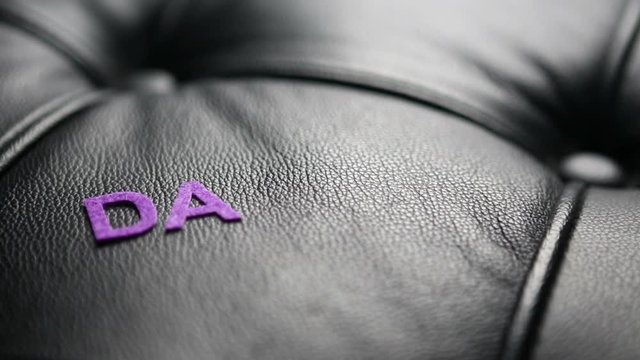the german word for thank you appears on black leather
