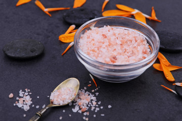 Salt scrub ,body polish concept. Spa background. Volcanic rocks and pentals. Relaxation, body care treatment, spa, wellness concept