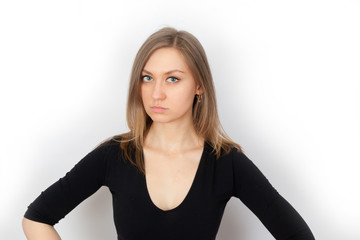 Young woman looks strictly and cautiously