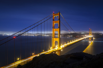 Fototapeta na wymiar Golden Gate Bridge in San Francisco, California at night with traffic light trails.