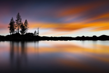 Lake Tahoe Sunset at Sand Harbor Beach. Long exposure with smooth water - obrazy, fototapety, plakaty