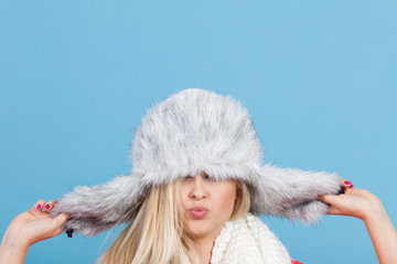 Woman wearing winter furry warm hat