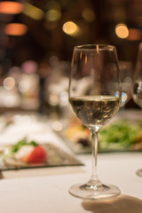 Glass of white wine on a restaurant table