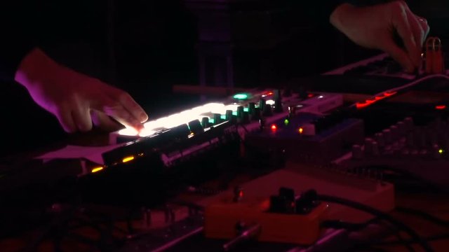 Live performance of an electronic DJ on the mixing console