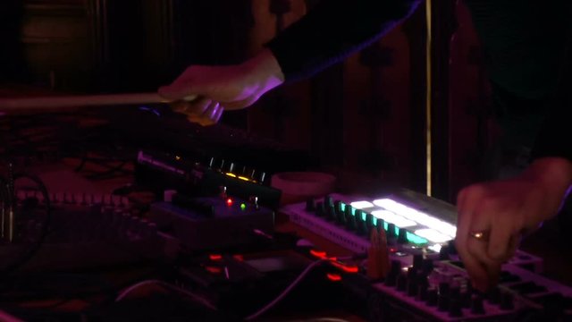 Live performance of an electronic DJ on the mixing console