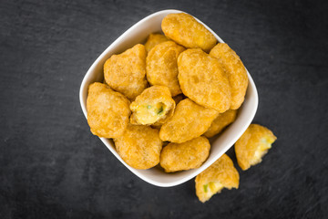 Cheese Nuggets (with Chilis) (selective focus, close-up shot)
