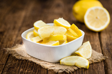 Fresh made Lemon Slices on a rustic background