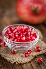 Wooden table with Pomegranate (selective focus)