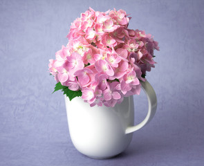 the sweet  hydrangea flowers in white vase