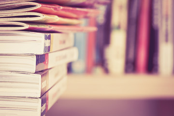 Close up edge of colorful magazine stacking 