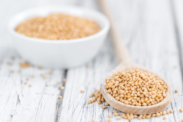 Mustard Seeds on vintage wooden background